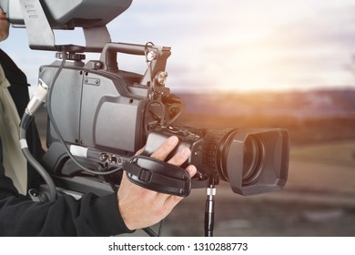 Hand with black camera