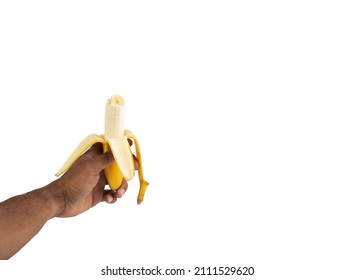 hand of black man holding a bitten banana white background isolated
