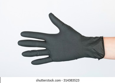 Hand In Black Medical Glove. Stock Image Macro.