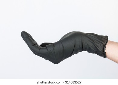 Hand In Black Medical Glove. Stock Image Macro.