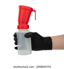 Hand In Black Nitrile Glove Holds A Teat Dip Cup For Udder Cow Disinfection, Isolated On White Background