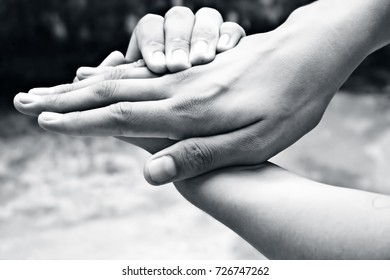 A hand blocking another hand to do mischiefs.