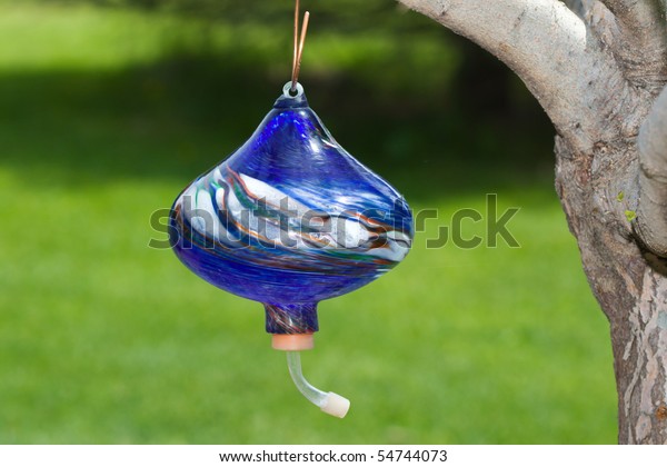 Hand Blown Glass Hummingbird Feeder Hanging Royalty Free Stock Image