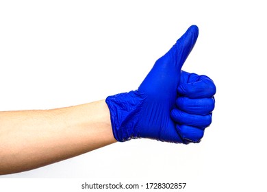 Hand In Blue Rubber Protective Medical Surgical Glove On A White Background Hand Clenched Fist Thumb Raised Up