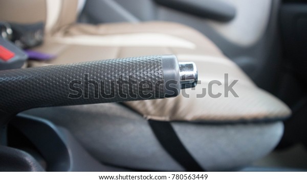 Hand brake brake, hand, car, parking, vehicle,\
handbrake, driver, closeup, security, seat, power, control, brakes,\
equipment, automobile, lever, interior, system, safety, auto,\
driving, black, casual,