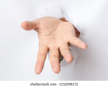 Hand Breaking Through Paper Pointing At You