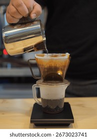 Hand brewing drip coffee using pour over method