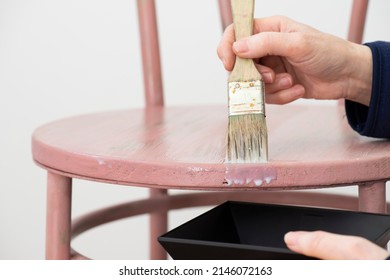 Hand With Brush, Applying Wax Varnish To Wooden Chair