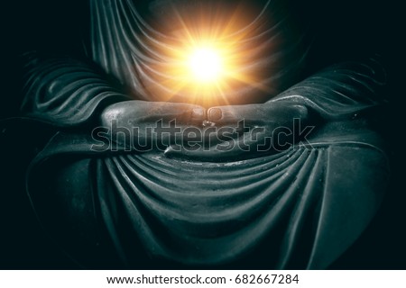 hand of buddha with light of wisdom and power of breath in religion of asian concept.