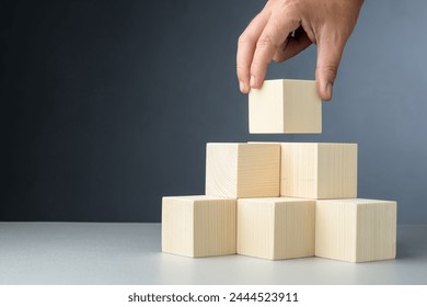 Hand build a strong pyramid, or stable step stairs, and put the last one on top, build a permanent success, teamwork, development plan