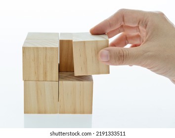 Hand To Building Wooden Cube Puzzle.