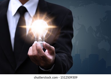 Hand of businessman holding illuminated light bulb,creative concept design. - Shutterstock ID 1512509309