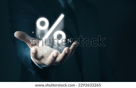 Hand of Businessman holding percentage symbol for financial banking increase interest rate or mortgage investment dividend from business growth concept. Economic recession. Interest rate burden.
