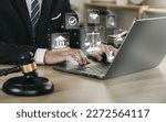 Hand of the businessman or  Lawyer with legal services icon on the laptop screen for Legal advice online in Labor law for a business company legal. concept of legal consultant and lawyer 