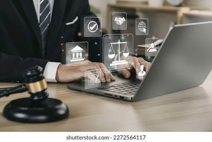 Hand of the businessman or  Lawyer with legal services icon on the laptop screen for Legal advice online in Labor law for a business company legal. concept of legal consultant and lawyer  - Shutterstock ID 2272564117