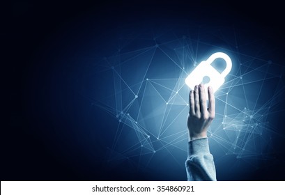 Hand of businessman on dark background with security glowing sign