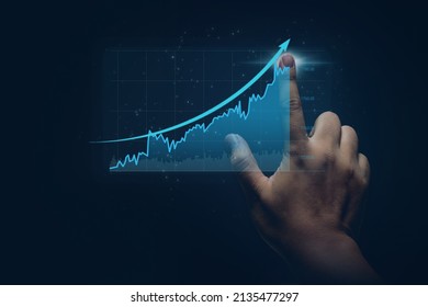 Hand of businessman pointing touch to chart financial goals. finger economic business graph planning forecast marketing grow investment concept. - Shutterstock ID 2135477297