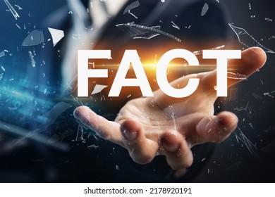 Hand of a businessman presenting the word fact. Facts, truth or accurate information in media news or business concept.