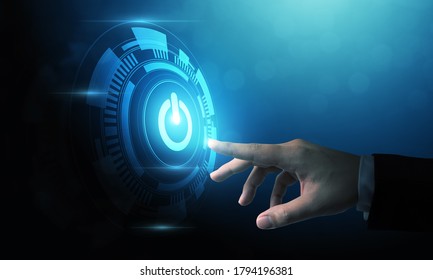 Hand Of Businessman Pressing Power Button Over Computer. Start Or Shut Down Concept