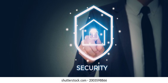 Hand Of Businessman Pushing Sign Virtual Lock While Security System And Safety With Home For Protection And Privacy Of Family, Secure And Access Digital For Residential, Business Futuristic Concept.