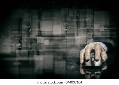 Hand Of Businessman In Suit On Dark Digital Background Using Wireless Computer Mouse