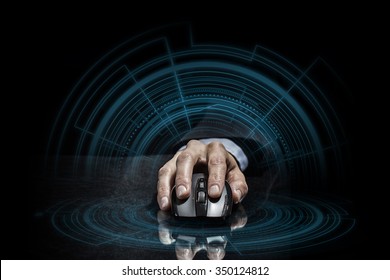 Hand Of Businessman In Suit On Dark Digital Background Using Wireless Computer Mouse