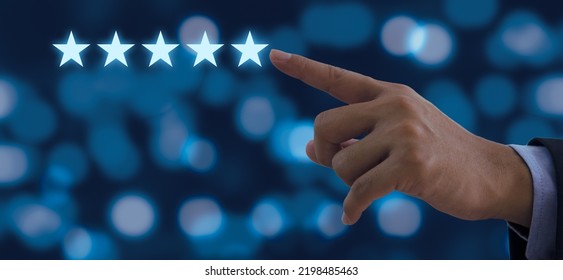 Hand Of Businessman Touching Five Stars Symbol To Increase Rating On Background