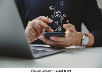 Hand of businessman using smart phone with coin icon, Online transaction, fintech business, Internet investment e-Commerce concept.
