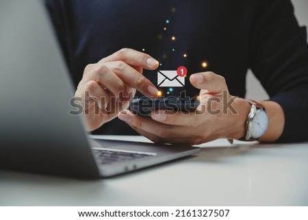 Hand of businessman using smartphone for email with notification alert, Online communication concept.