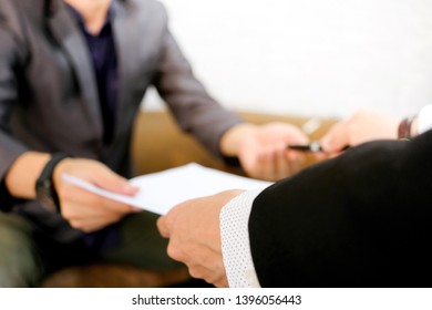 Hand Of Businesswoman Submit A Signed Document And A Pen. Business Man Signing Documents Signing A Business Deal In Office.Business Ideas And Collaboration