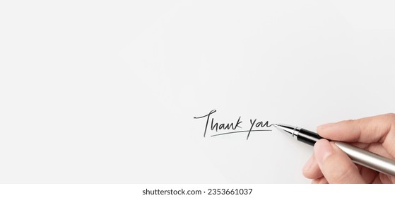 A hand of businesswoman writing on paper in the office. Hand writing thank you on piece of paper. - Powered by Shutterstock