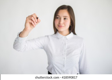 Hand of businesswoman writing on transparent screen