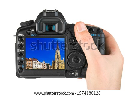 Hand with camera and Novi Sad - Serbia image (my photo) isolated on white background