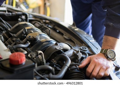 Hand of car mechanic. Auto repair garage. - Shutterstock ID 496312801