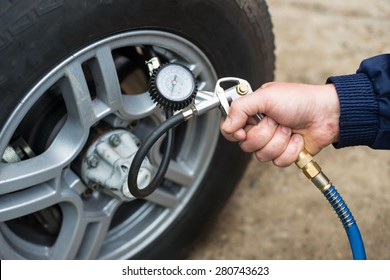 Hand And Car Wheel Add Air Pressure