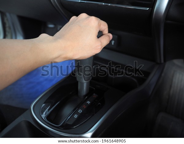 Hand catch at\
gear auto of car interior the\
car