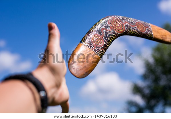 The hand catches the Australian boomerang