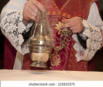 Hand Of Catholic Priest At Incense