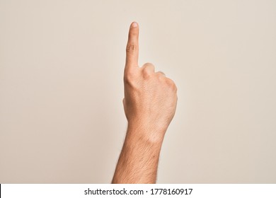 Hand of caucasian young man showing fingers over isolated white background ...