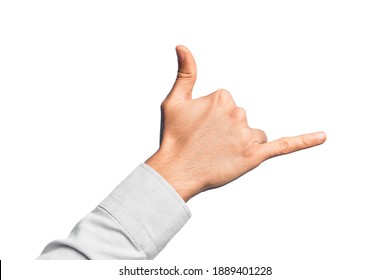 Hand Of Caucasian Young Man Showing Fingers Over Isolated White Background Gesturing Hawaiian Shaka Greeting Gesture, Telephone And Communication Symbol