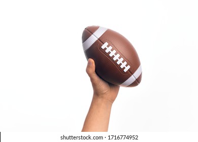 Hand of caucasian young sporty man holding football ball over isolated white background - Powered by Shutterstock