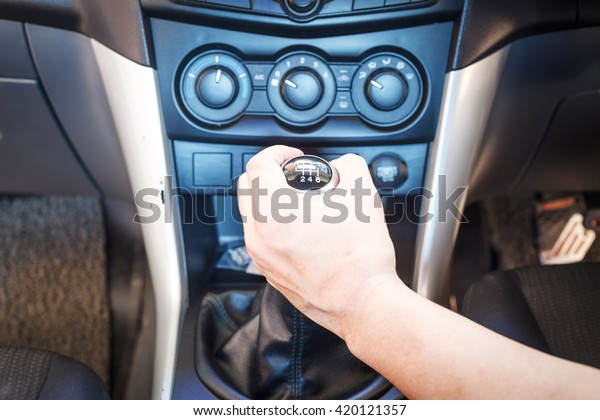 Hand changing a car transmission. Transmission\
Type 6 speed Dual clutch.