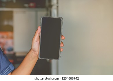 Hand Of Children Holding A Modern Smart Phone