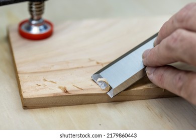 A Hand Chisel Being Used In Woodworking 