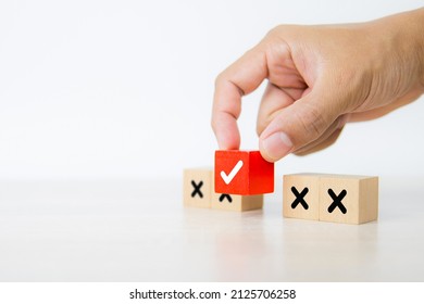 Hand Choose Check Mark On Cube Wooden Toy Block Stack With Cross Symbol For True Or False Changing Mindset Or Way Of Adapting To Change Leader And Transform Quiz Answer And Poll Concept