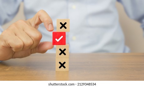 Hand Choose Check Mark On Cube Wooden Toy Block Stack With Cross Symbol For True Or False Changing Mindset Or Way Of Adapting To Change Leader And Transform Quiz Answer And Poll Concept