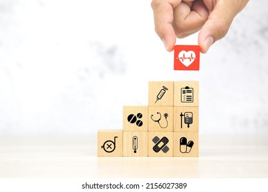 Hand Choose Heartbeat Pulse Signal Or Heart Rhythm Icon On Cube Wooden Block Stack With Health Care And Medical Symbol Concept Of Healthy Or Sick Prevent And Safety Insurance Planner