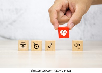 Hand Choose Heartbeat Pulse Signal Or Heart Rhythm Icon On Cube Wooden Block Stack With Health Care And Medical Symbol Concept Of Healthy Or Sick Prevent And Safety Insurance Planner