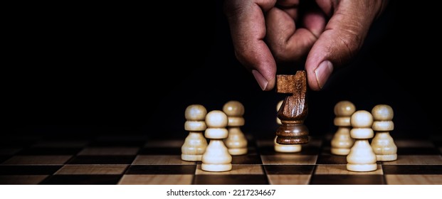 Hand Choose Knight First On Chess Pieces Concepts Of Leadership Or Wining To Challenge Or Battle Fighting Of Business Team Player And Strategy And Risk Management Or Human Resource.