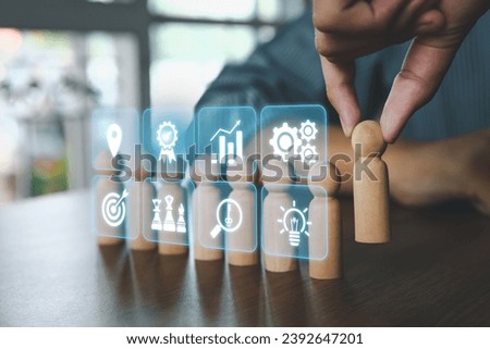 Hand choose wooden doll stand out first the group concept of leadership relationship or HR human resources officer or business team and personnel management job performance.